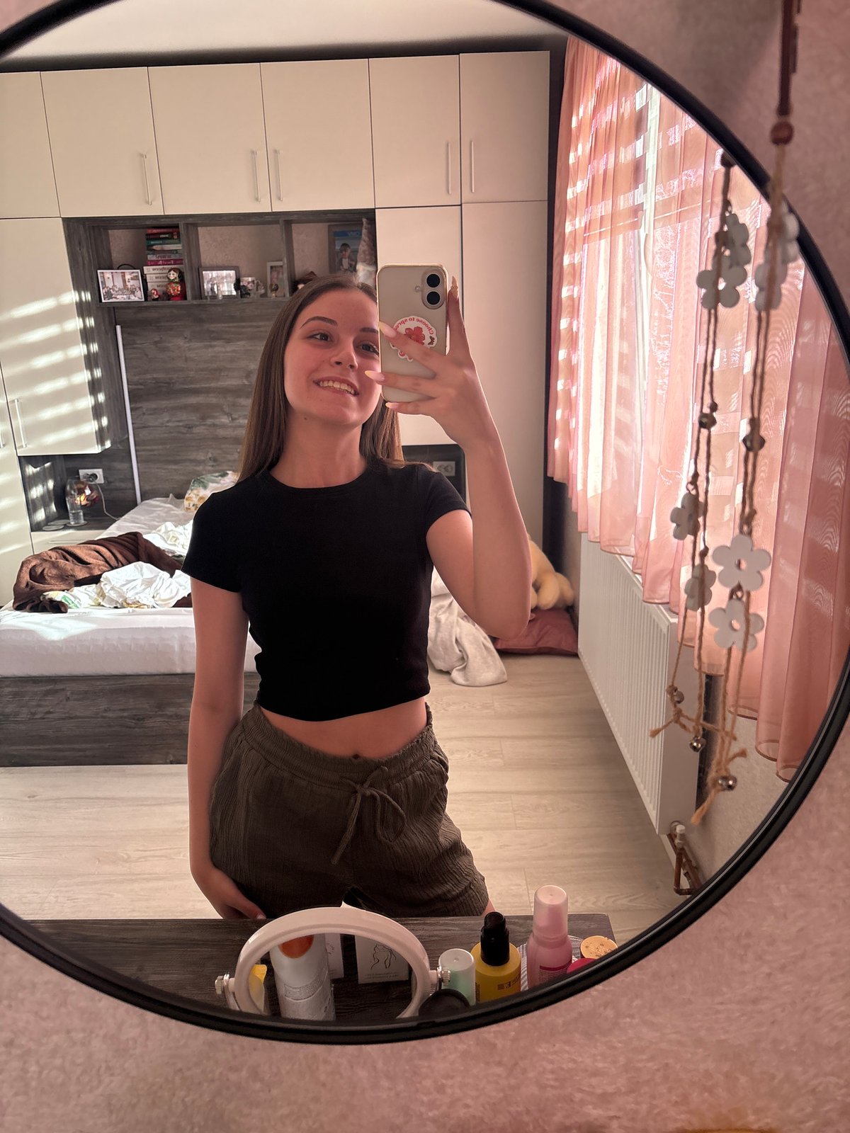 Woman takes mirror selfie in bedroom, Bulgarovo Bulgaria