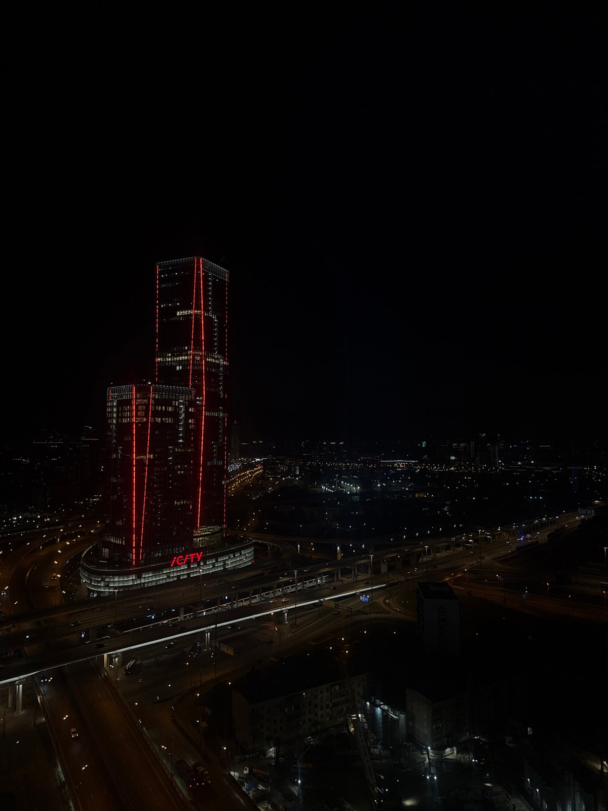 Nighttime urban photography captures illuminated buildings in Khimki