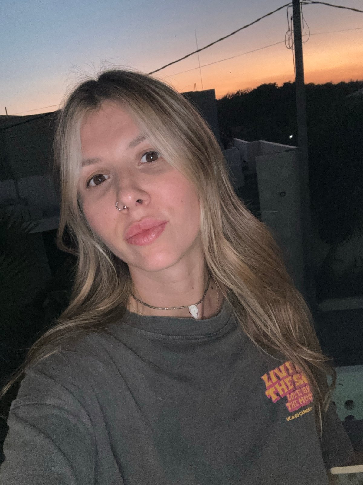 Dusk selfies and outdoor moments in a graphic tee