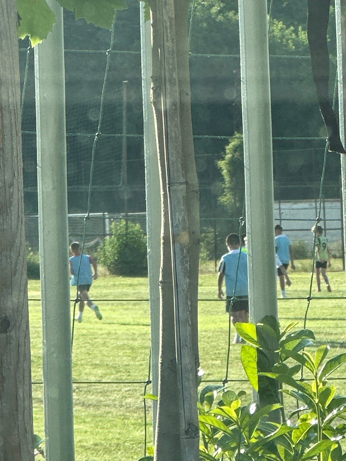 Children play soccer on field in Lovech, Bulgaria