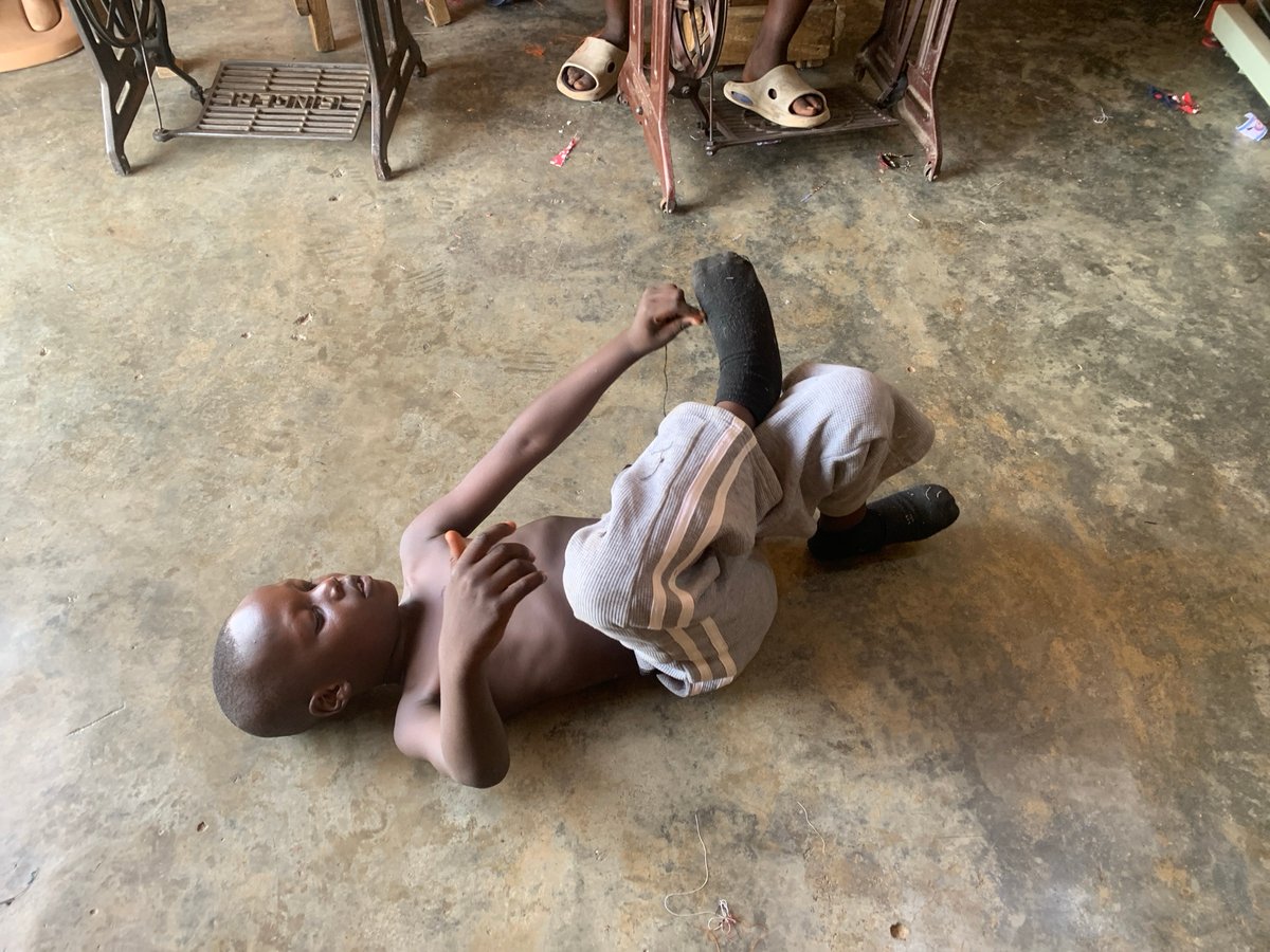 Daily life captured at Jos sewing workshop, children playing