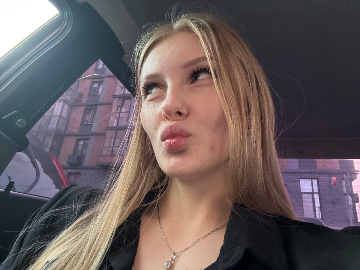 Woman takes selfies in Perm classroom and car