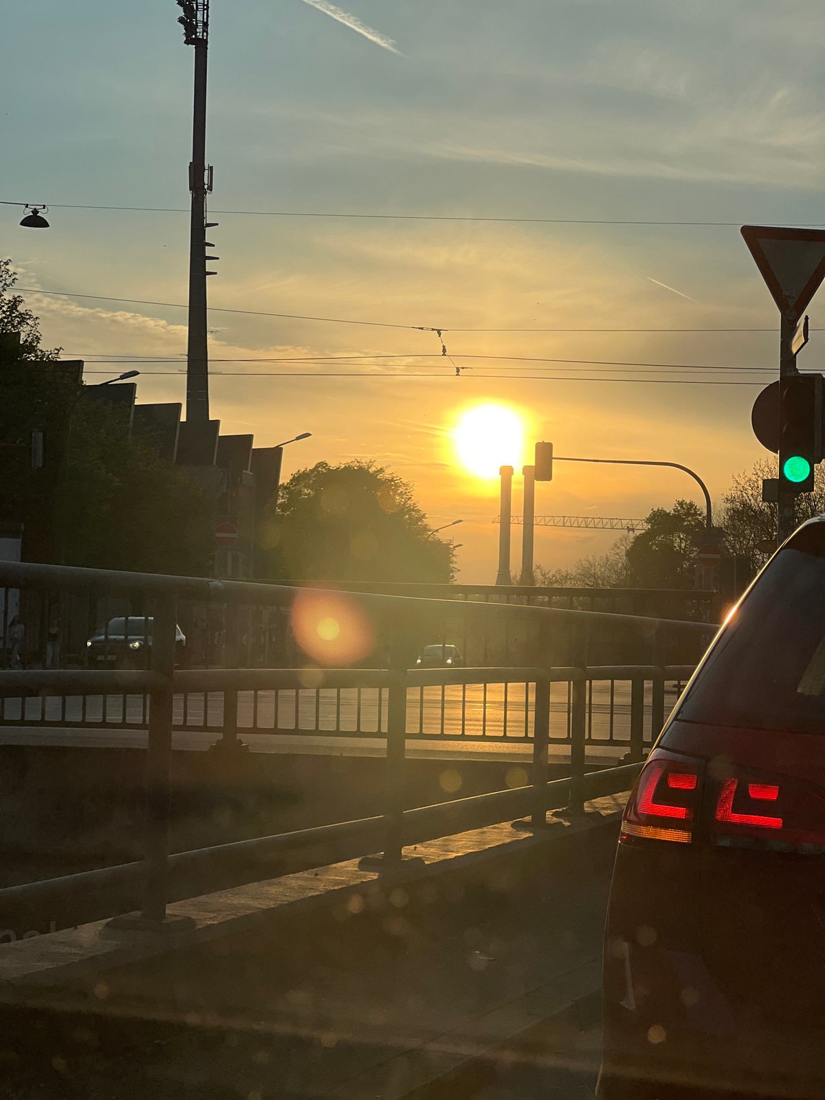 Sunset observed over Munich traffic intersection Saturday evening