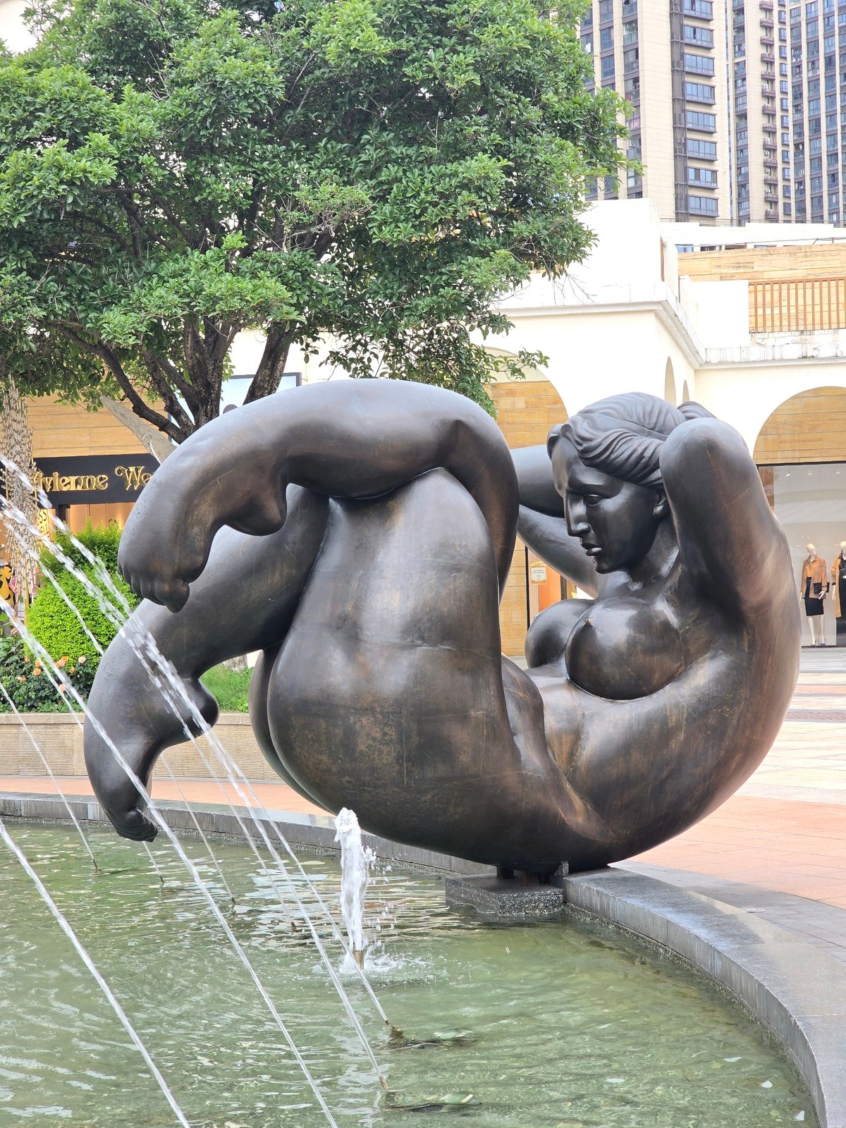 Bronze nude sculpture observed in Haining fountain plaza