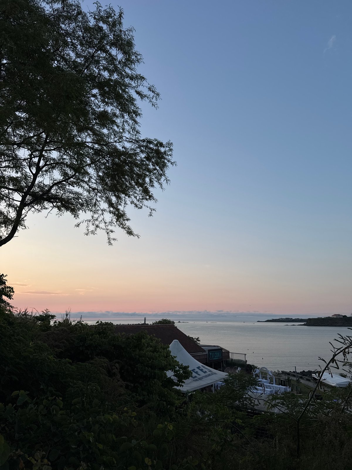 Evening captured in coastal Tsarevo: twilight skies to nightclub interior