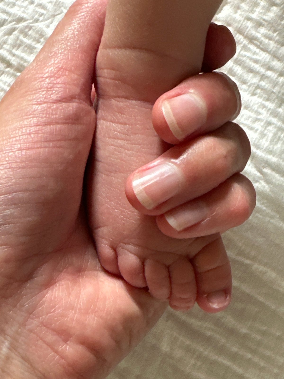 Gentle moment with baby's foot in Wisła