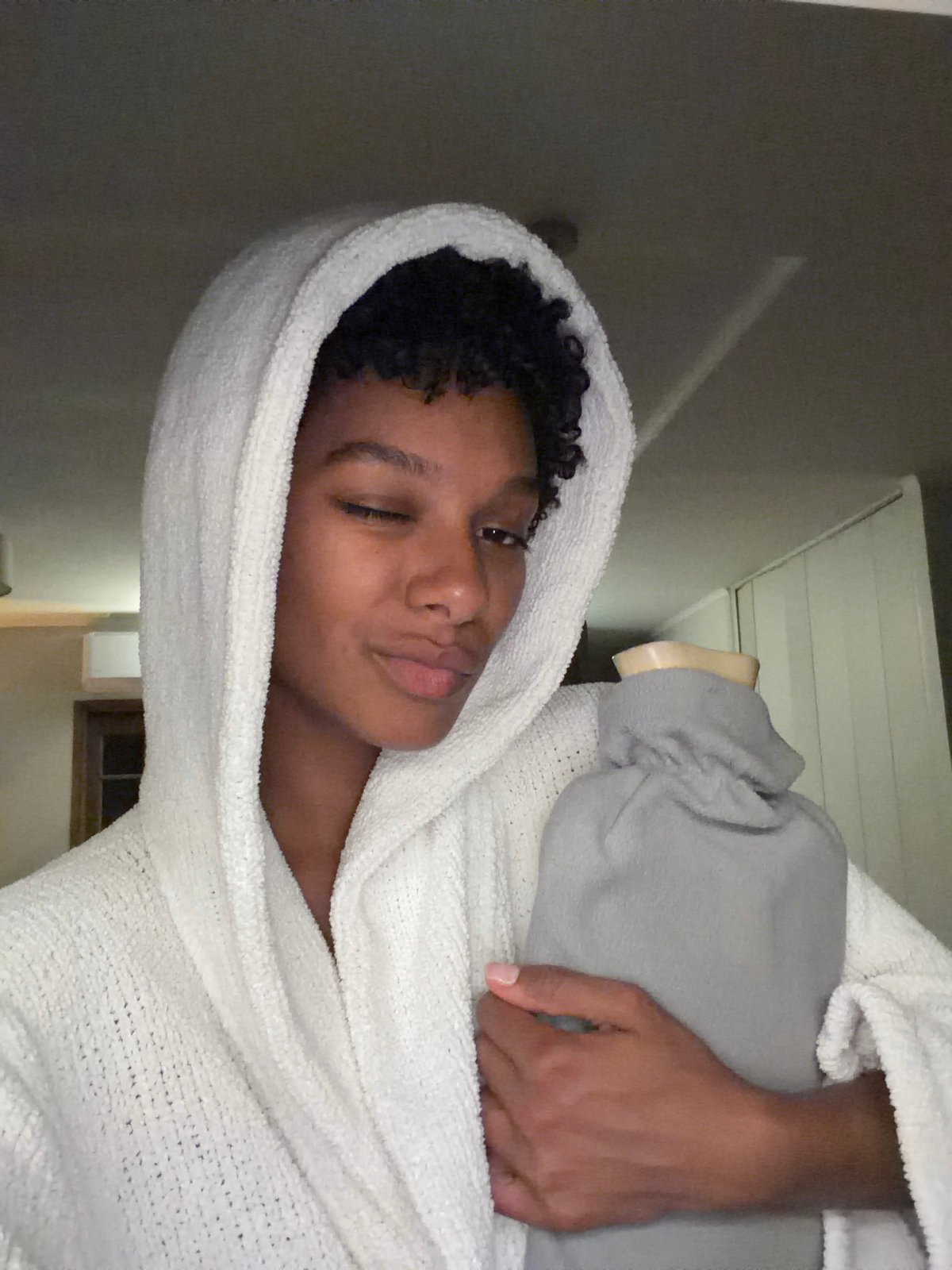 Person photographed in towel at Champs-sur-Marne residence