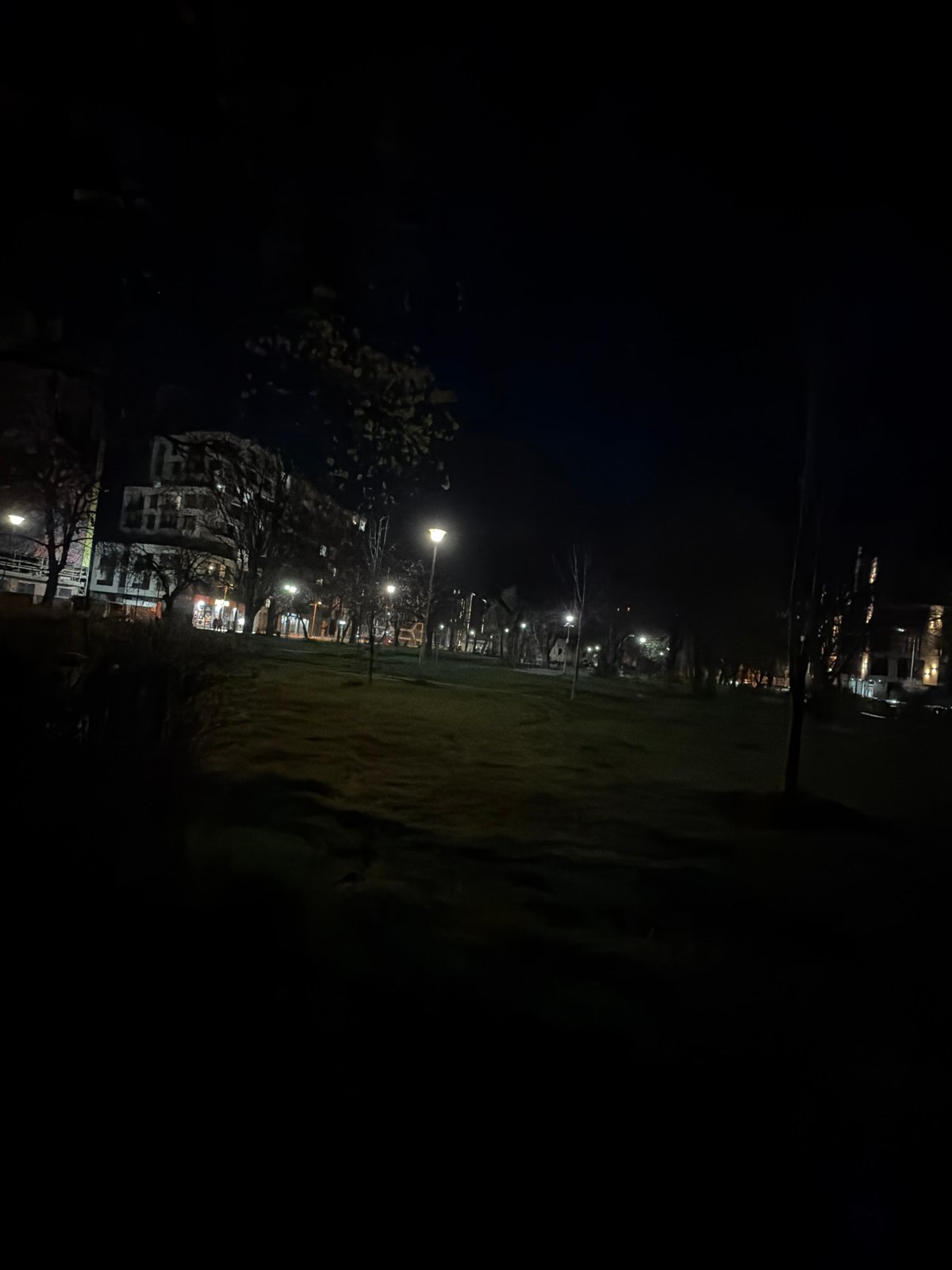 Evening street lights illuminate quiet Sofia residential area