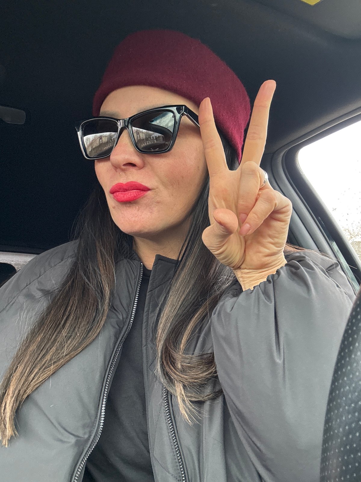 Woman photographed in vehicle interior in Chaikovsky, Russia