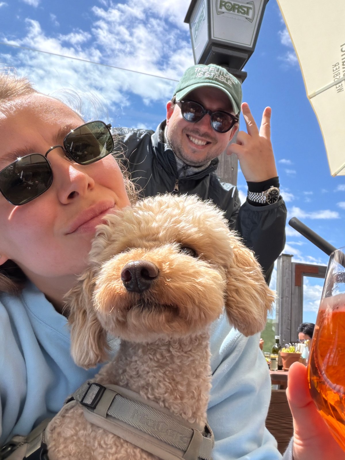Sunny beer garden selfie with a poodle in South Tyrol