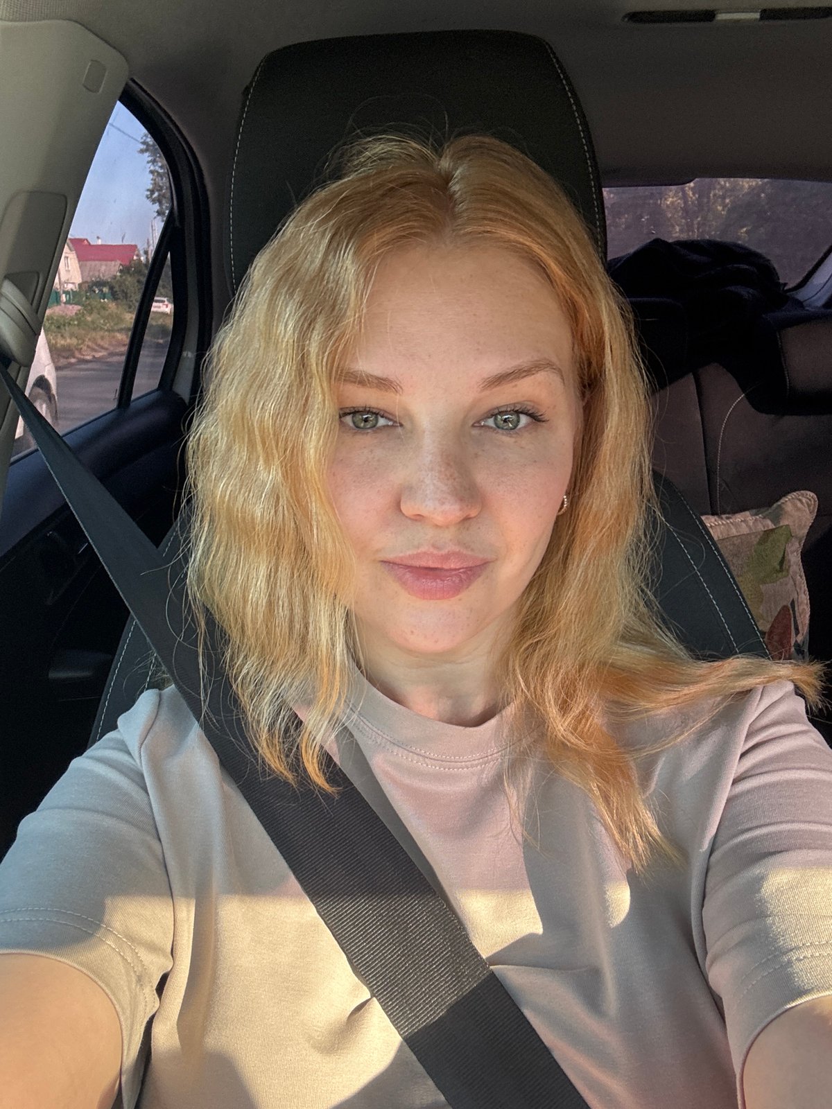 Quick driver's seat selfies on a road trip in rural Russia
