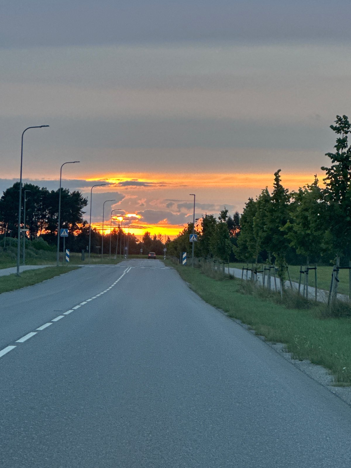 Sunset over a quiet rural road in Tiskre, Estonia