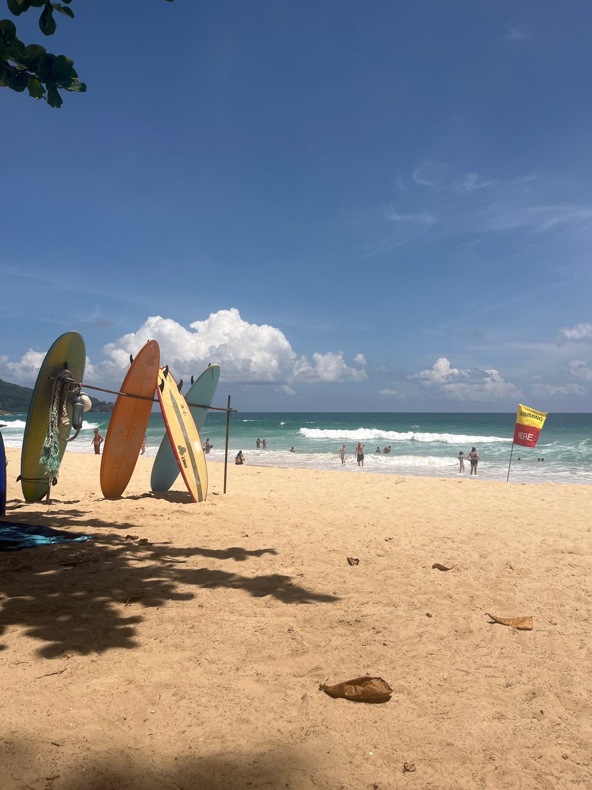 Choeng Thale beach morning: surf, strong currents, and coconuts