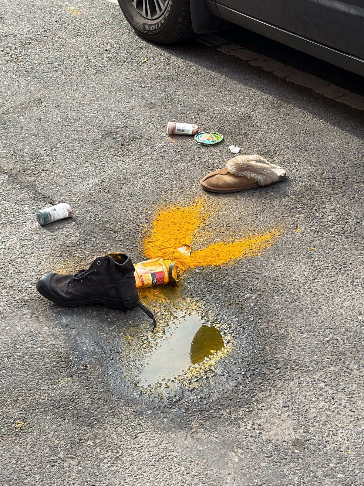Items scattered on New York street near vehicle