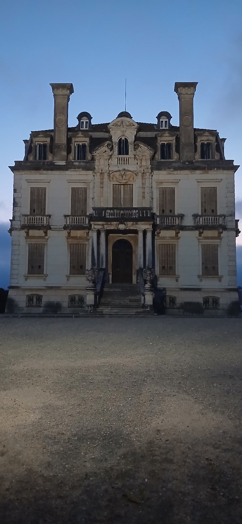 Abandoned ornate three-story building documented in disrepair