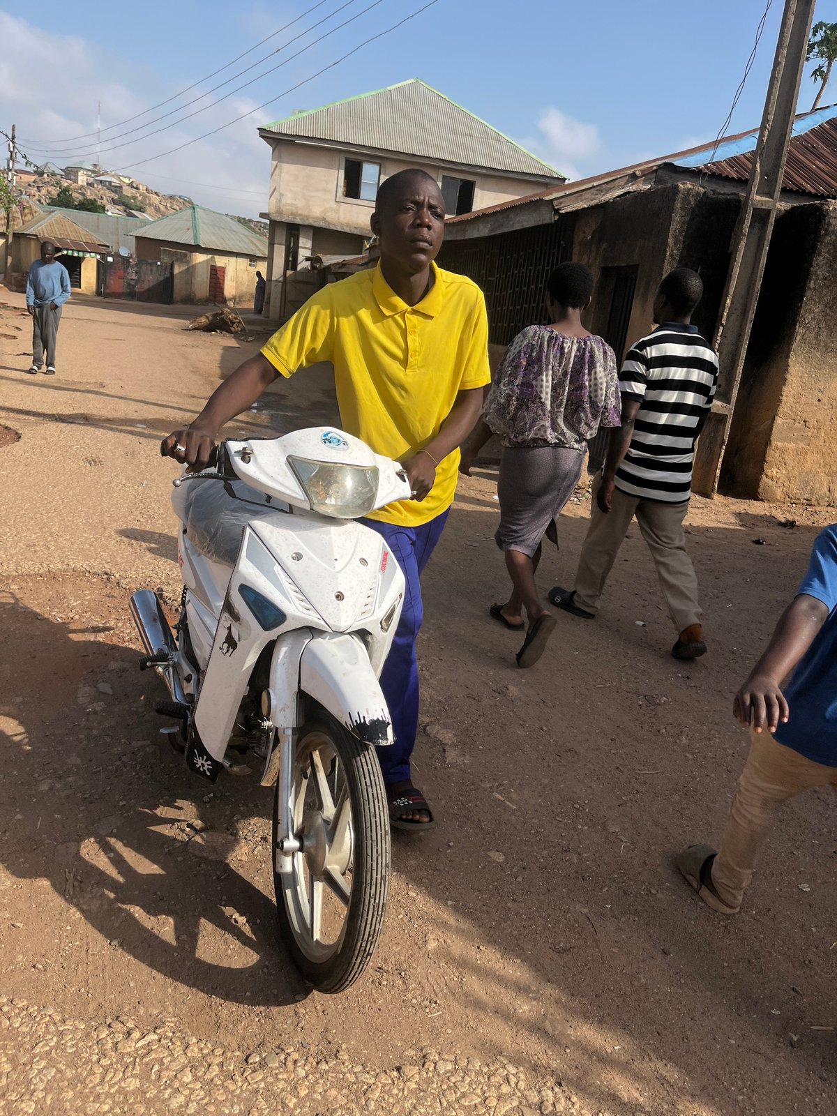 Morning street life documented across Jos, Nigeria neighborhoods