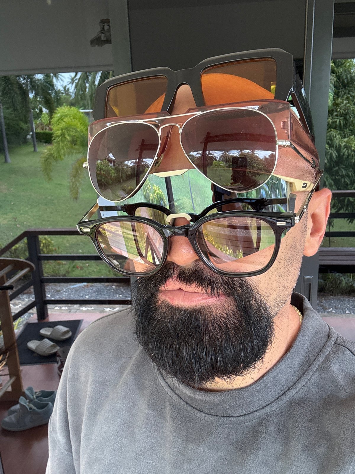 Stacking sunglasses in Ko Samui's tropical greenery