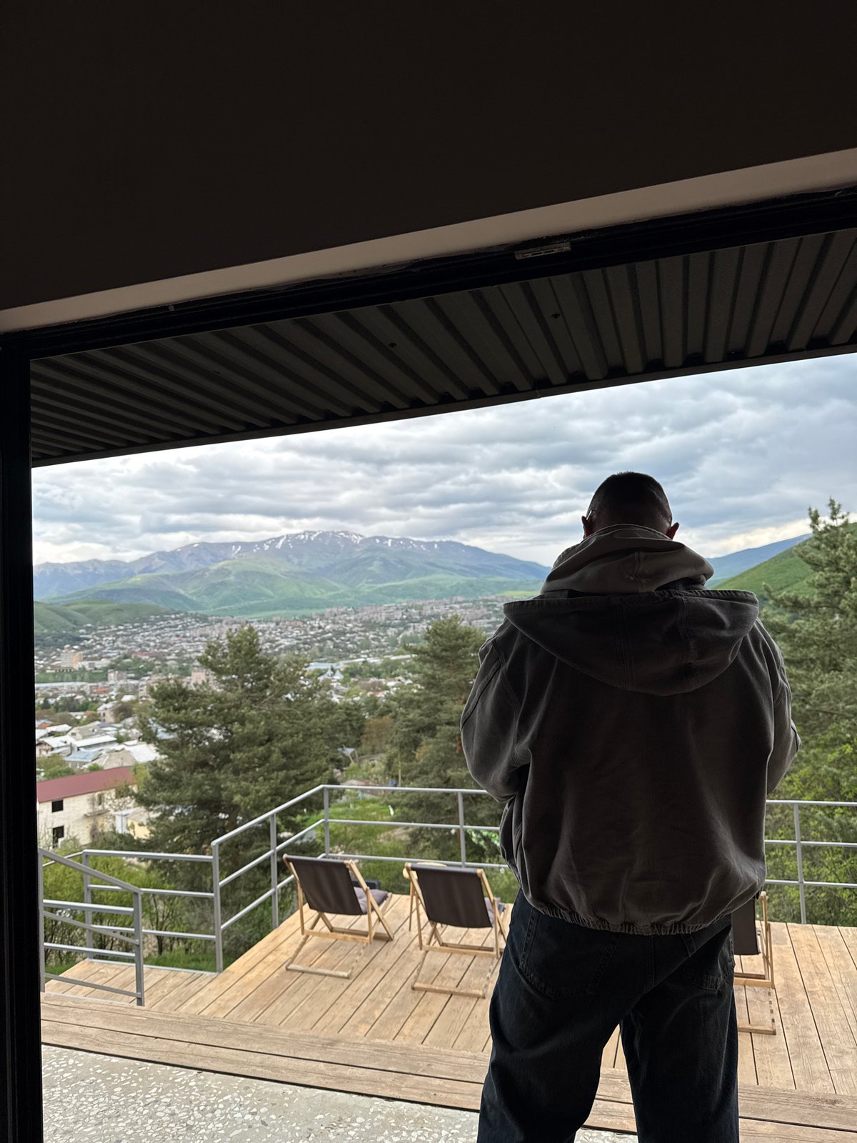 Person visits art gallery with mountain views in Vanadzor