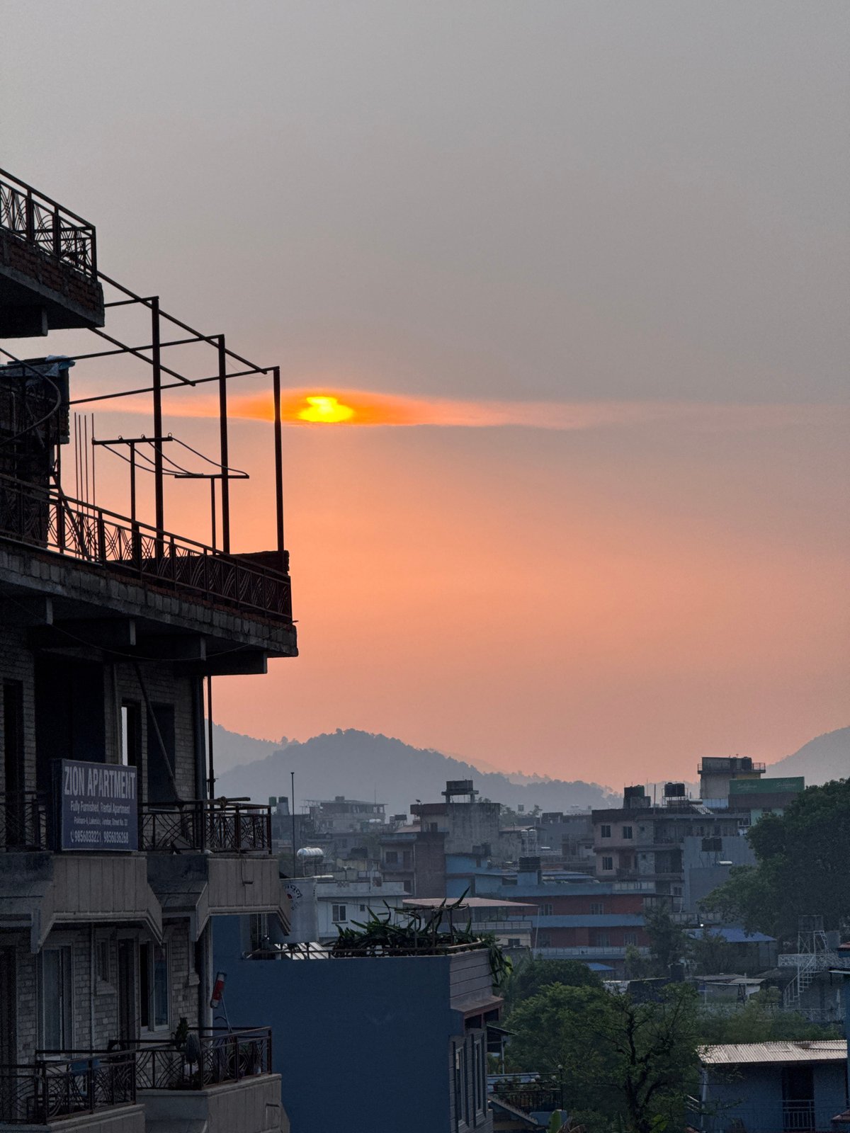 Sunset documented over Pokhara cityscape in Nepal