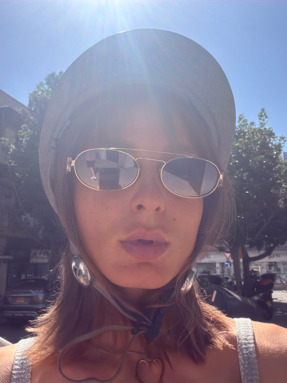 Helmet selfie and fresh delphiniums in Tel Aviv