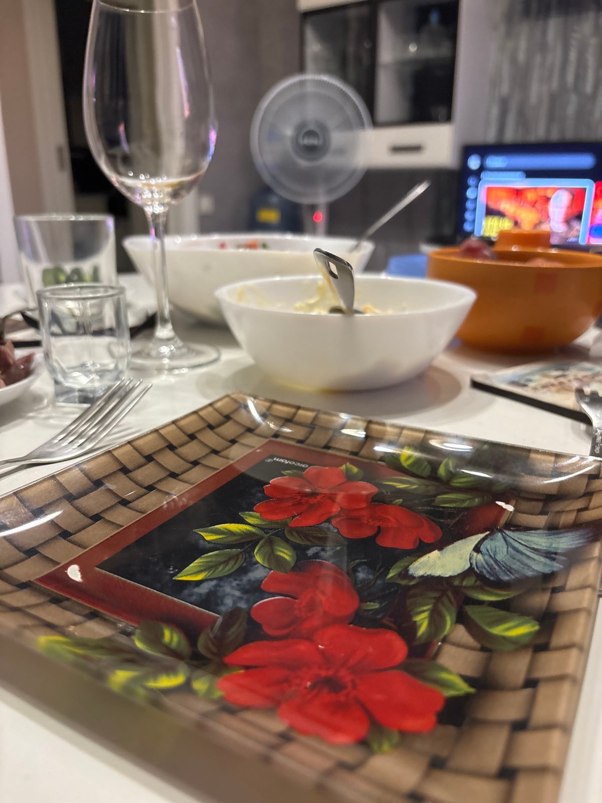 Indoor evening hang with plants, wine, and a city sunset
