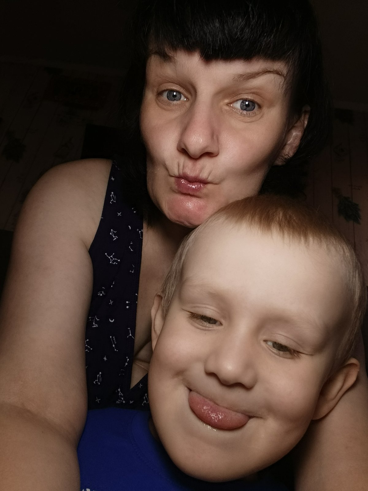 Woman and child share playful moments indoors