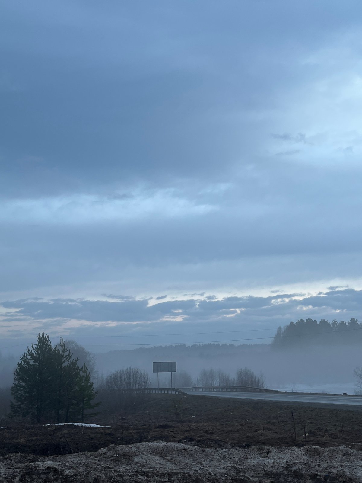 Heavy fog blankets rural highway near Kamennyi Kliuch, Russia