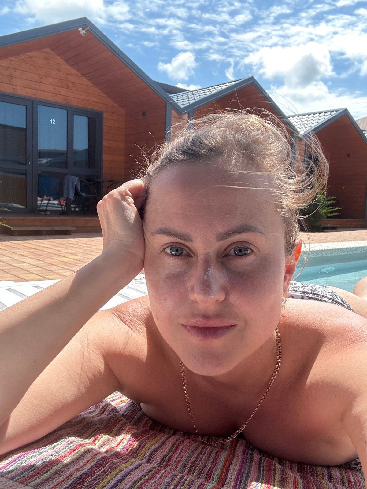 Poolside morning at a wooden cabin resort in Anapa