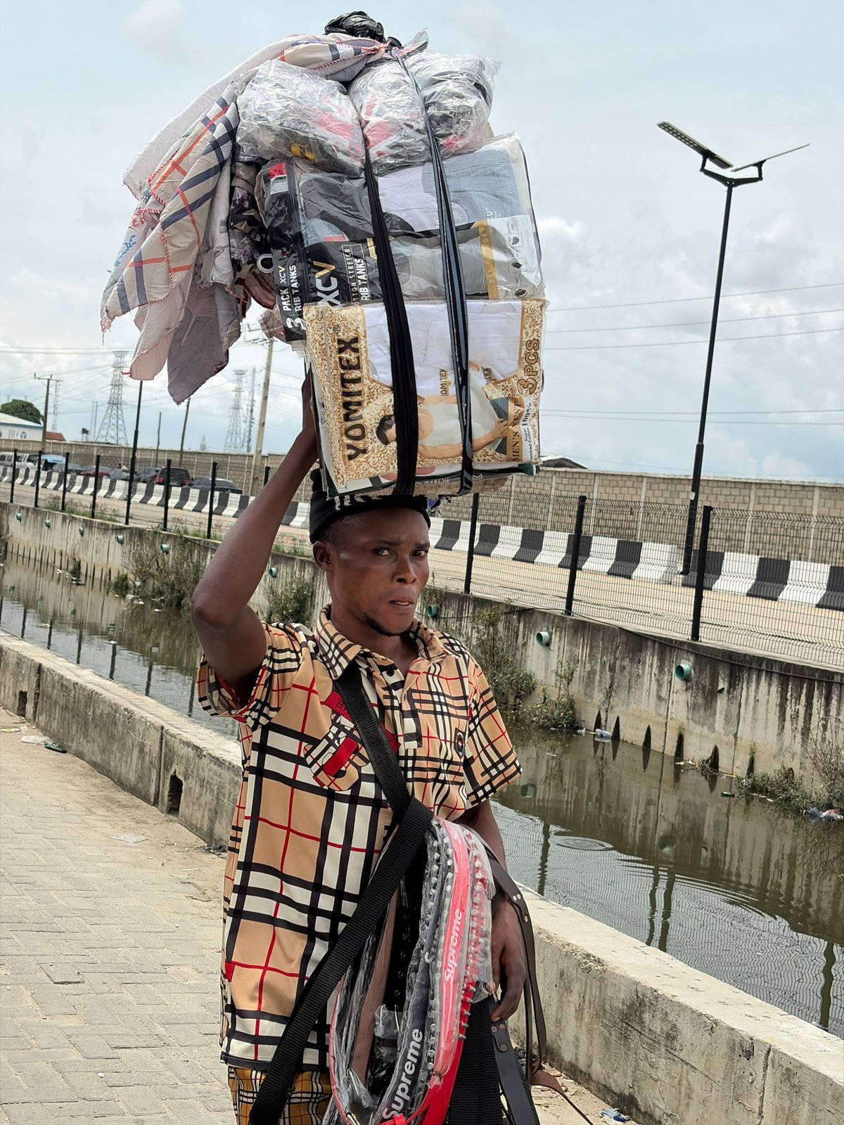 Everyday street activity in Igboefon, Lagos midday