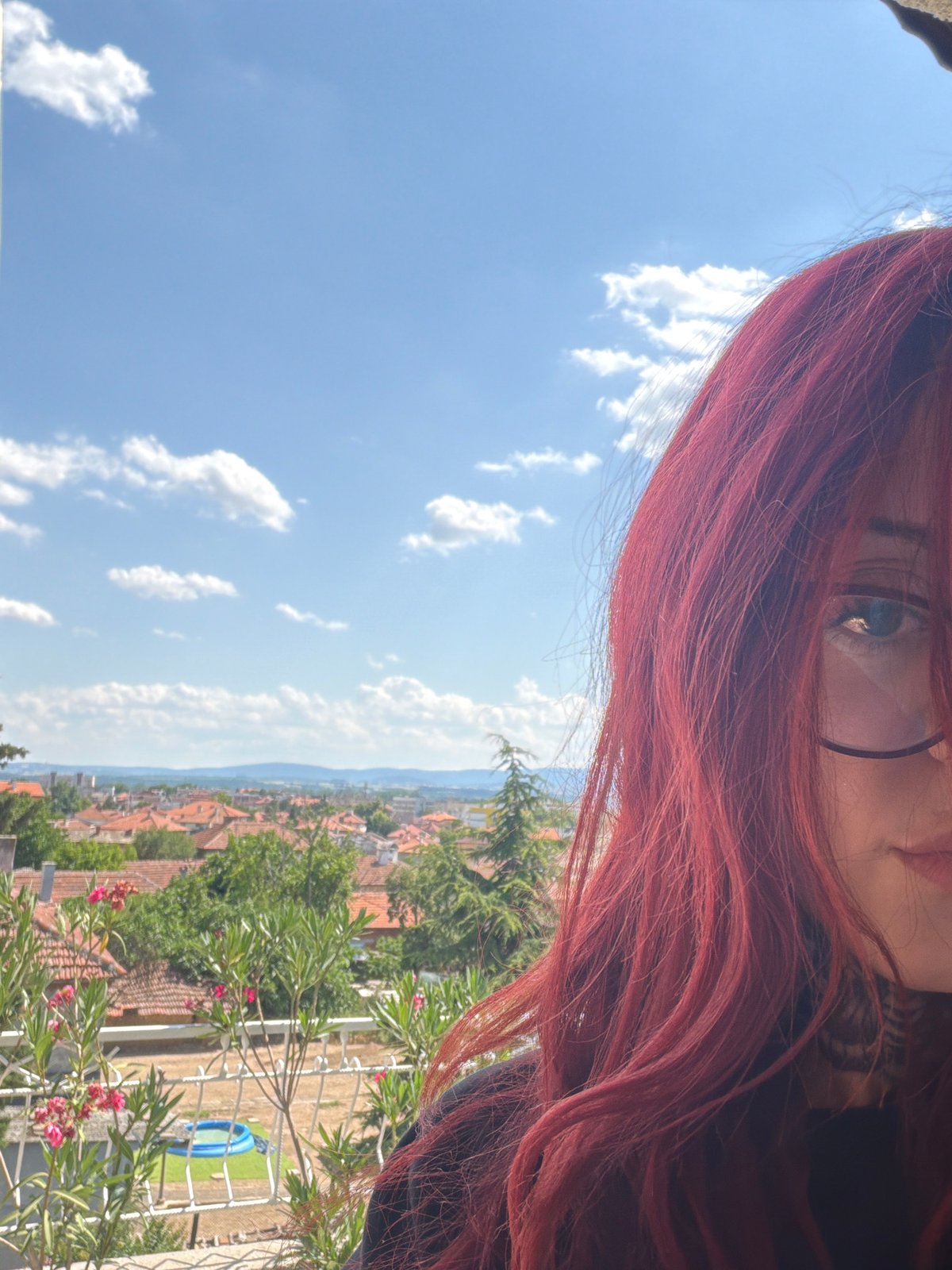 Balcony selfie session overlooking Svilengrad on a sunny afternoon