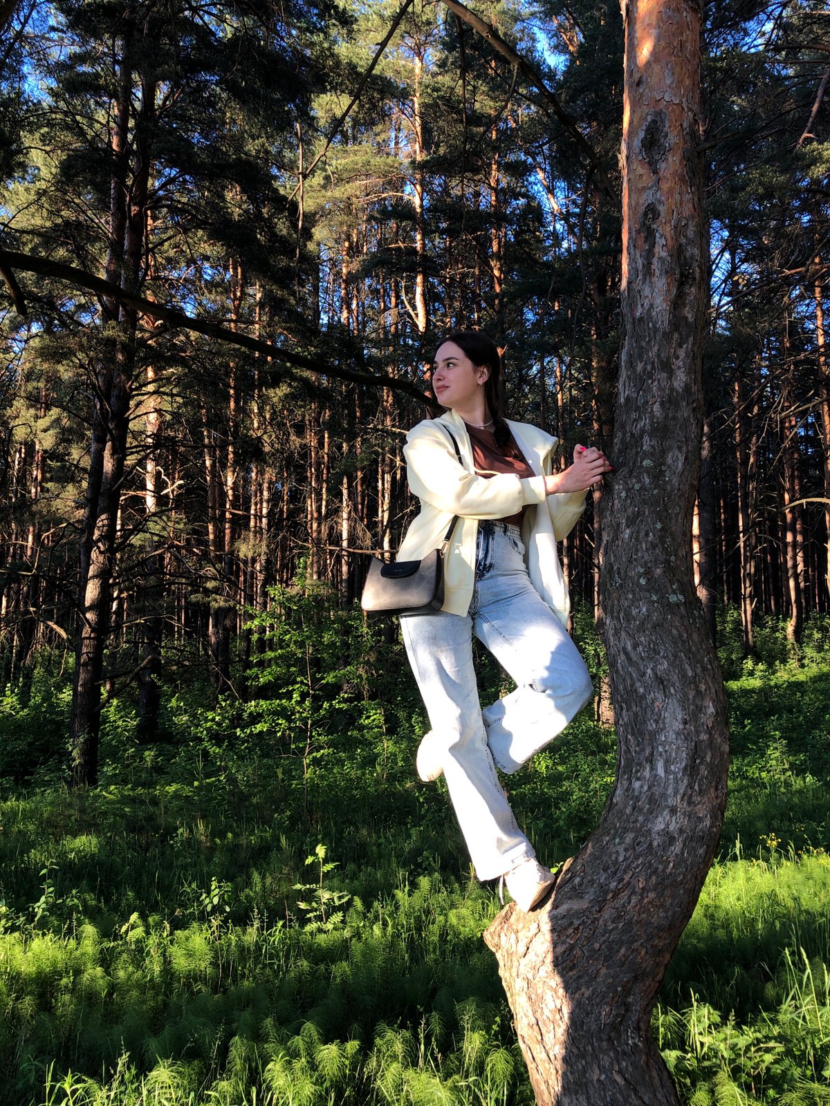Woman documents leisurely afternoon photoshoot in Chaikovsky, Russia forests