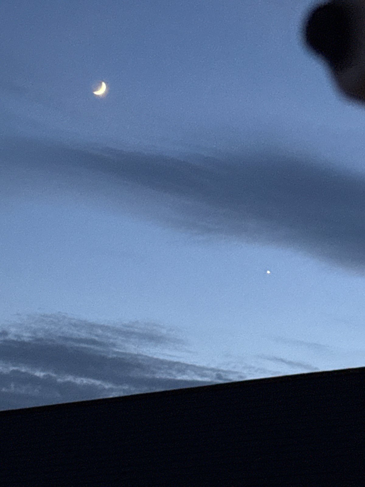 Twilight moon and urban lights observed in Great Yarmouth