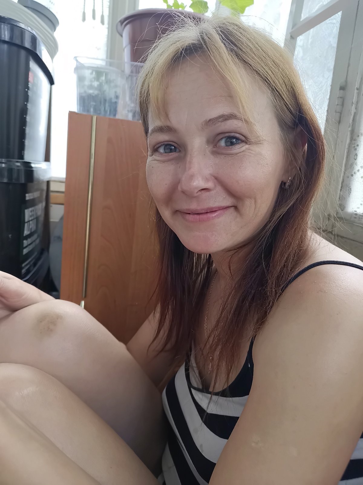 Smiling portrait in a striped tank top, Zaporizhzhia