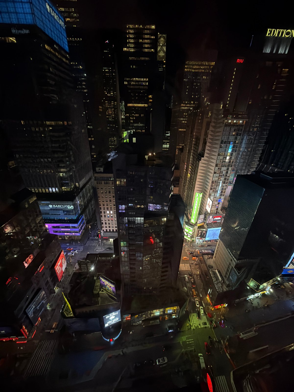 Aerial night view of illuminated Times Square captured