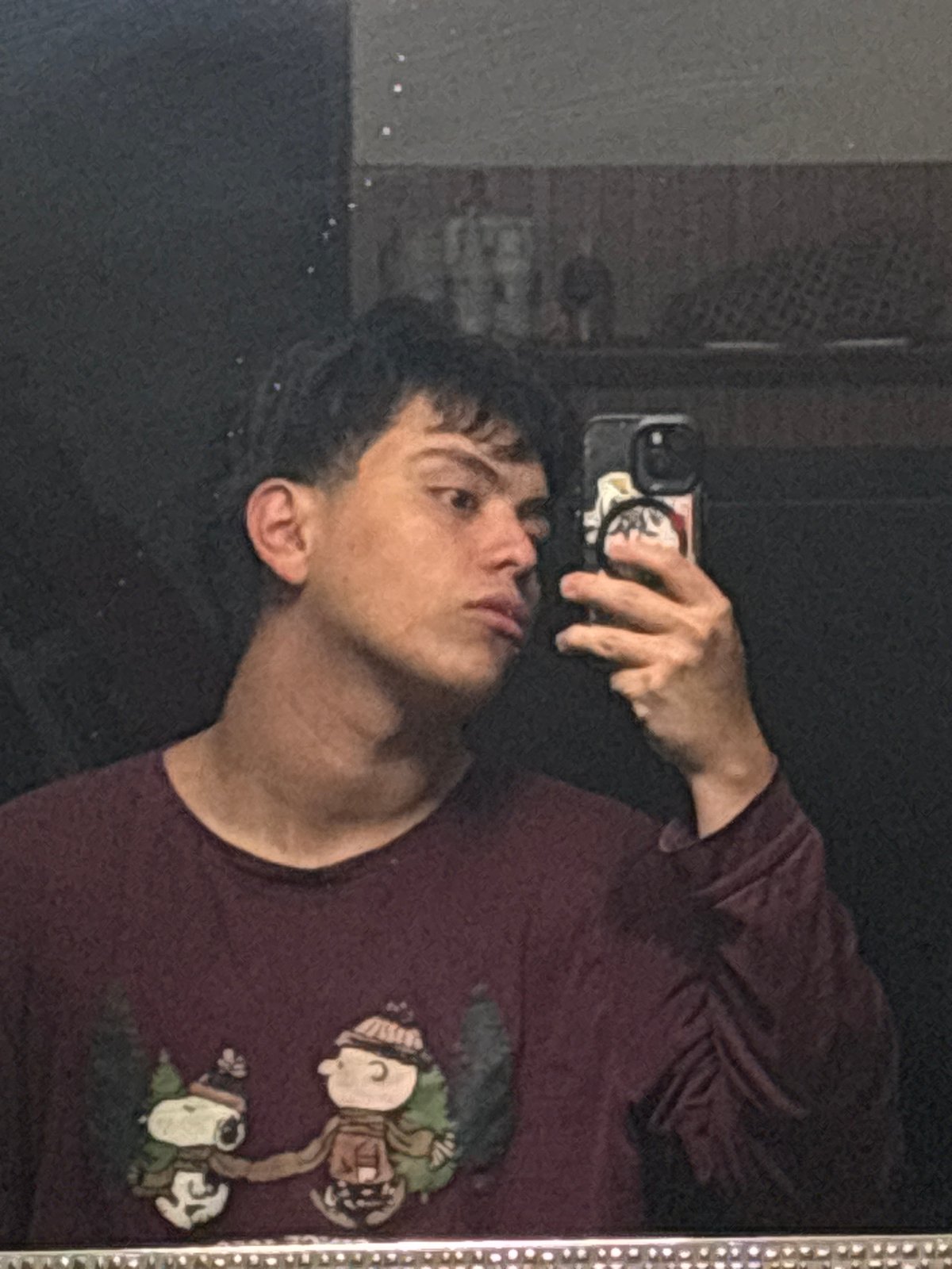 Back-to-back selfies in a dim Mexico City room