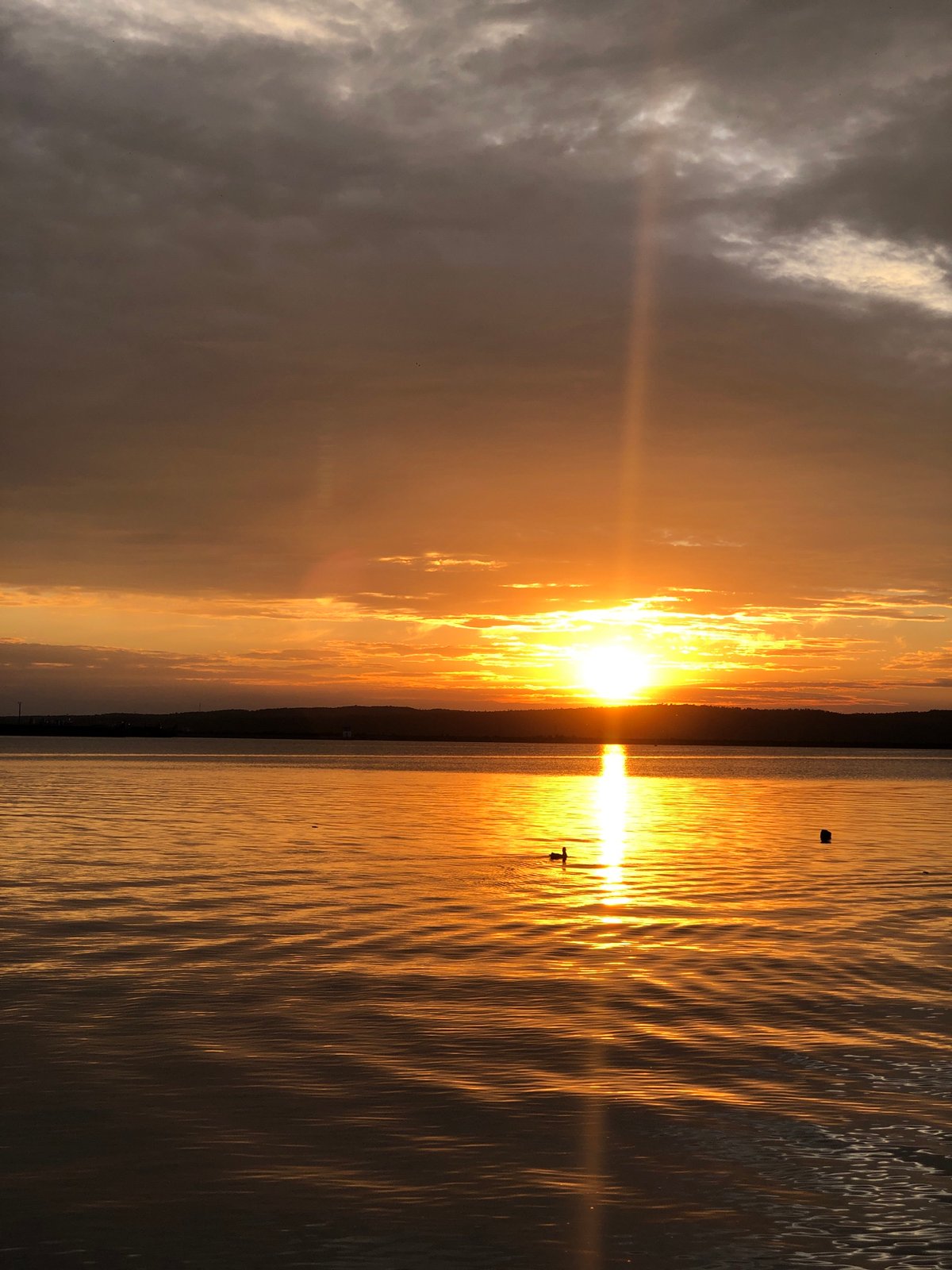 Golden hour on the Kama River draws a crowd to the shore