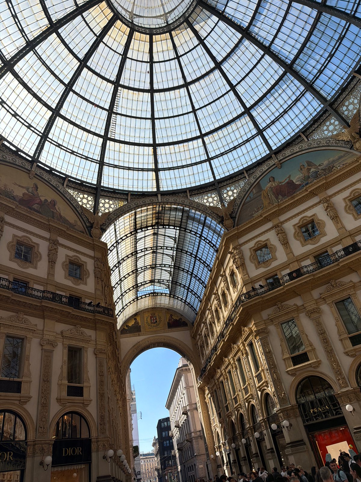 Tourist captures Milan's Duomo and historic streets in midday photos