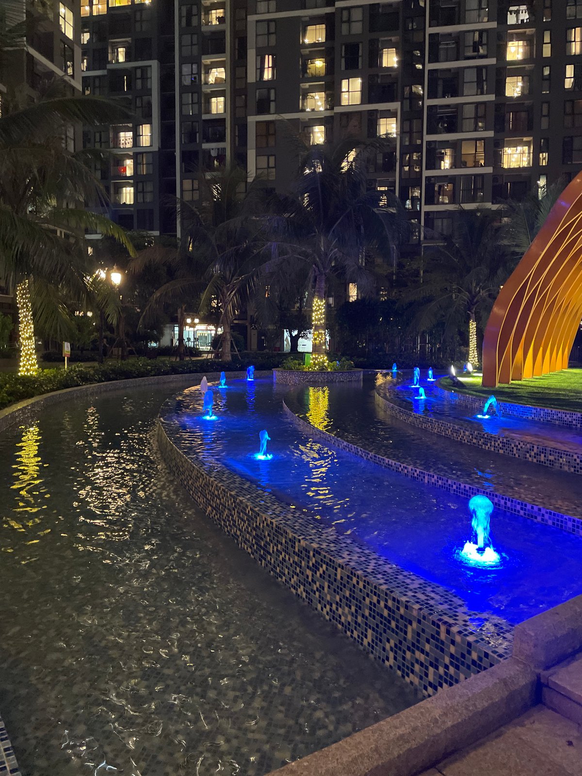 Night stroll through a Hanoi residential complex, flowers and all