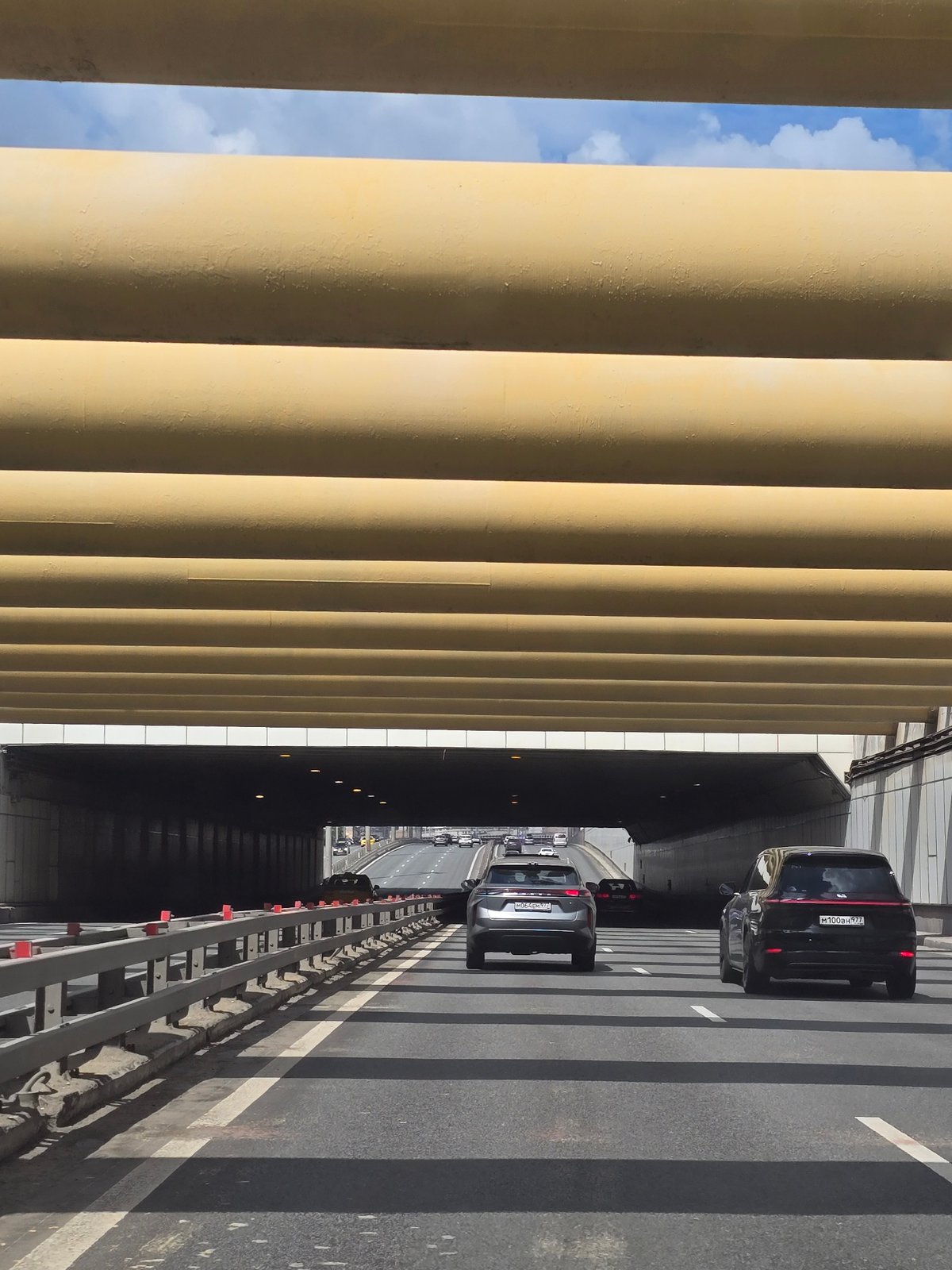 Moscow Third Ring Road traffic observed from pedestrian overpass