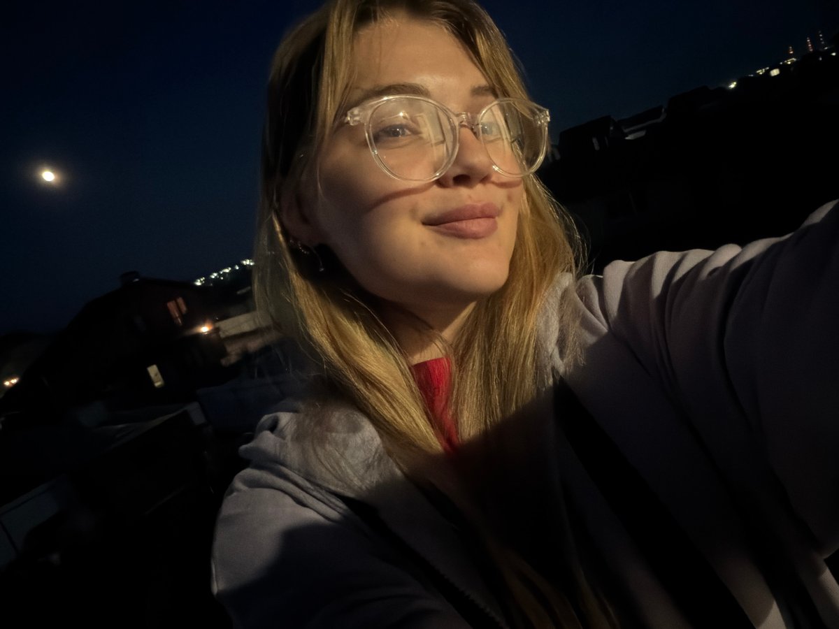 Woman takes nighttime selfies under full moon in rural Russia