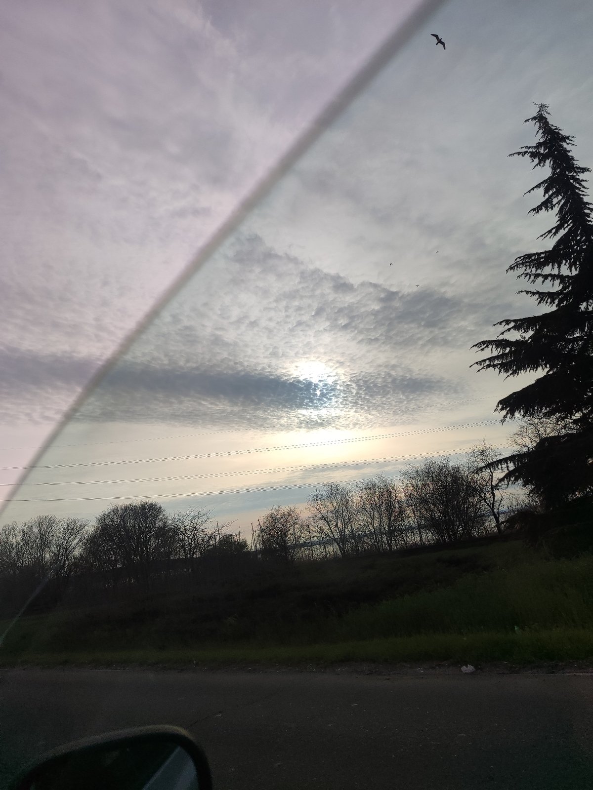 Vehicle occupant observes cloudy sky in Burgas, Bulgaria
