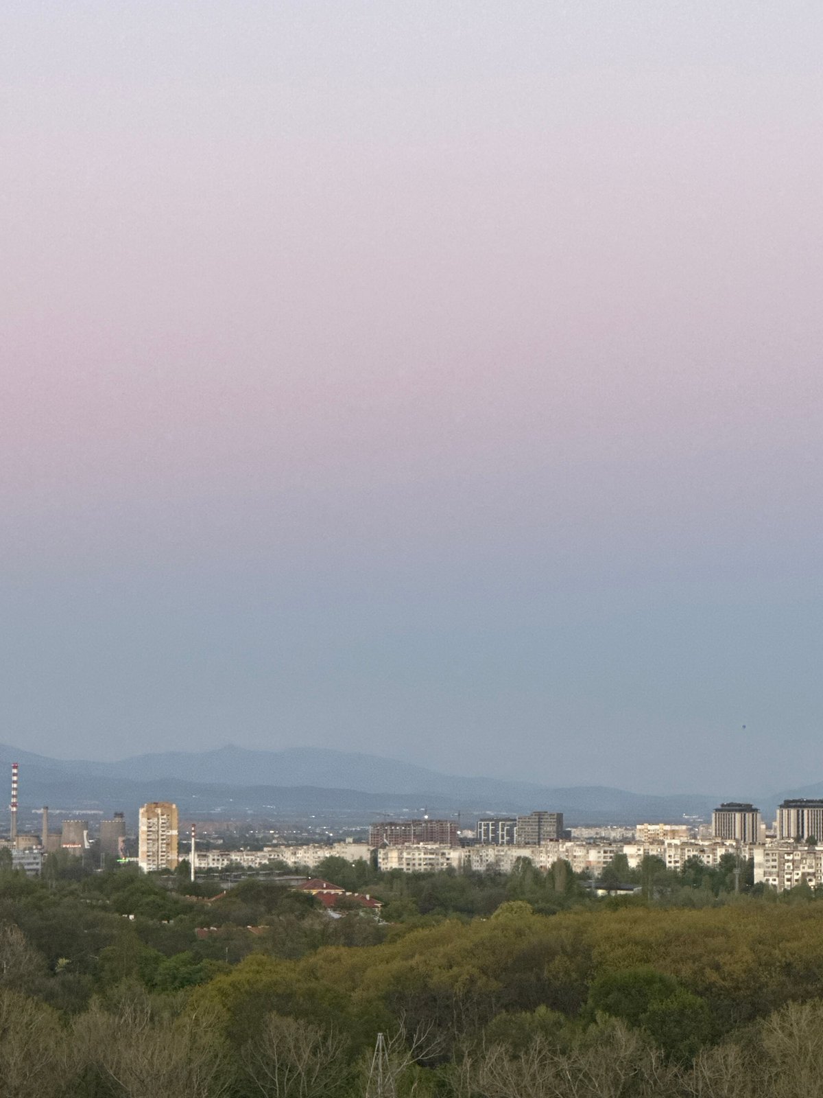 Sofia cityscape photographed from elevated viewpoint during evening hours