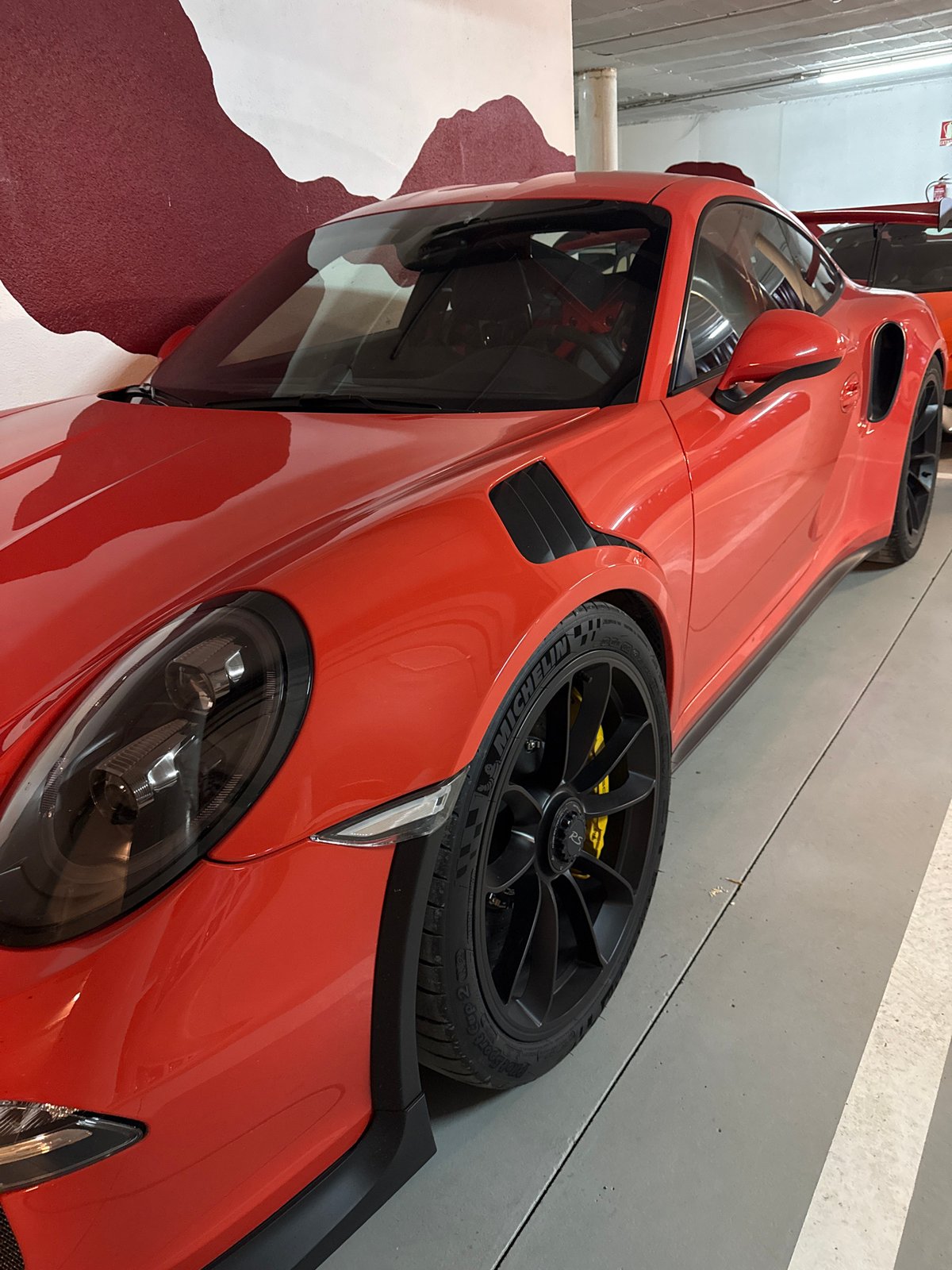 Luxury sports cars photographed in Benasque garage showroom