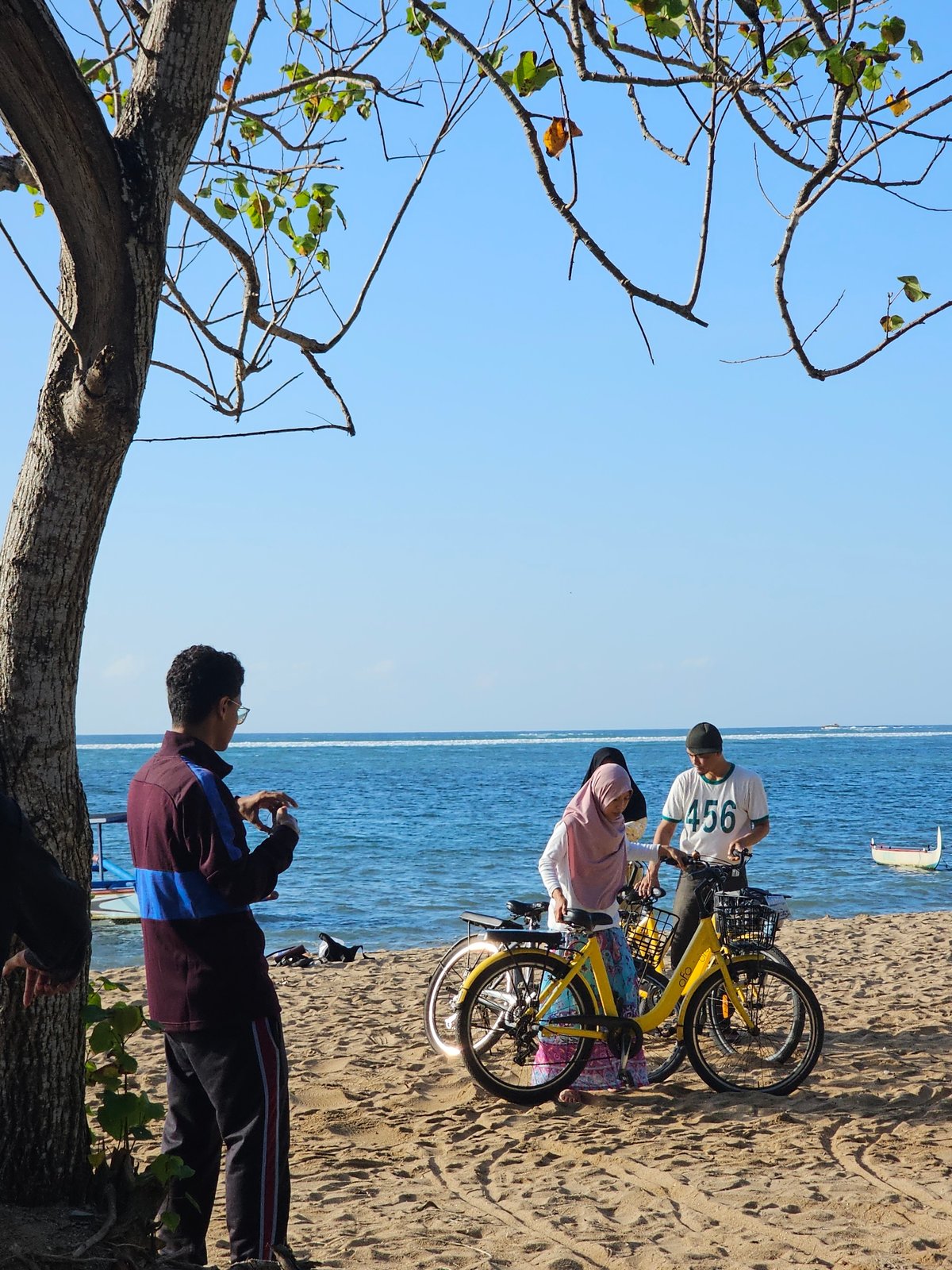 Yoga, beach walks, and boats at Sanur on a sunny morning