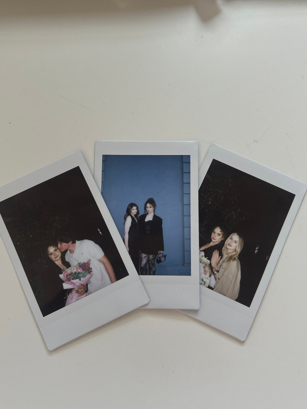 Flowers and photos arranged on table in Novi Sad