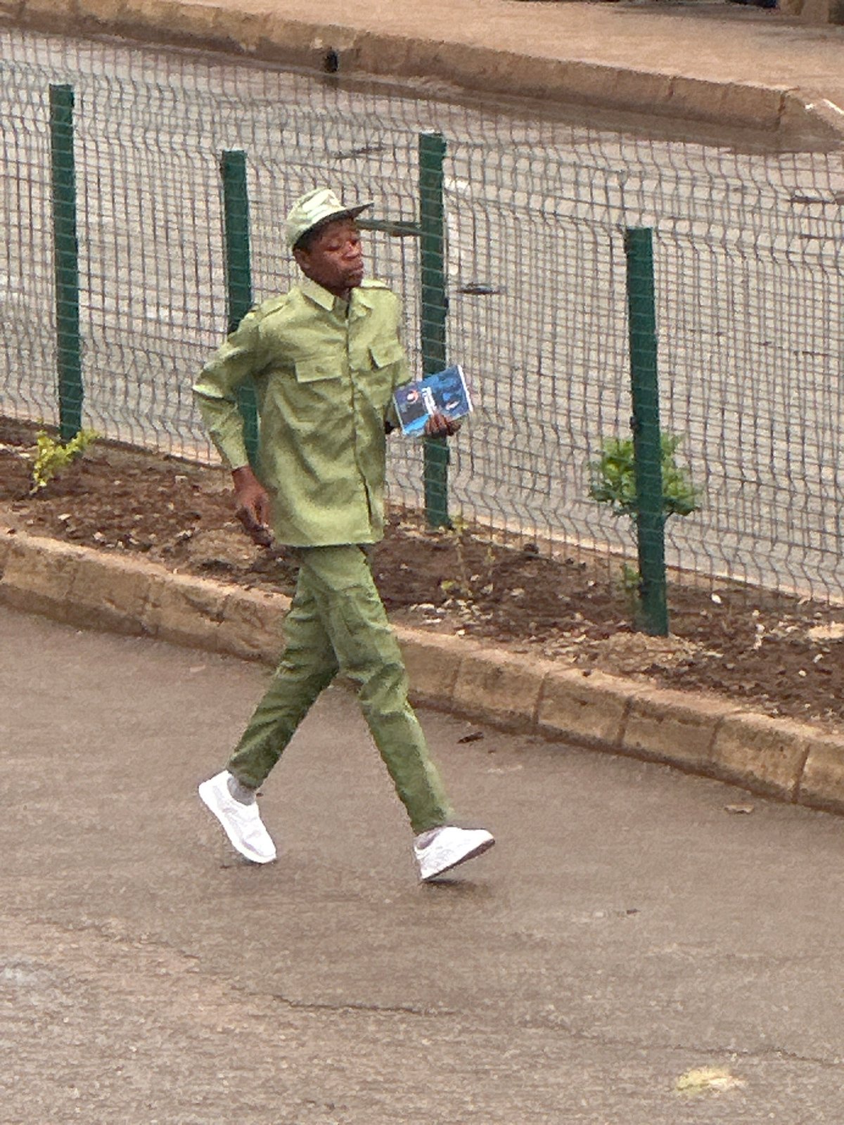 Morning street activity in Bukuru, Nigeria — people, goods, transit