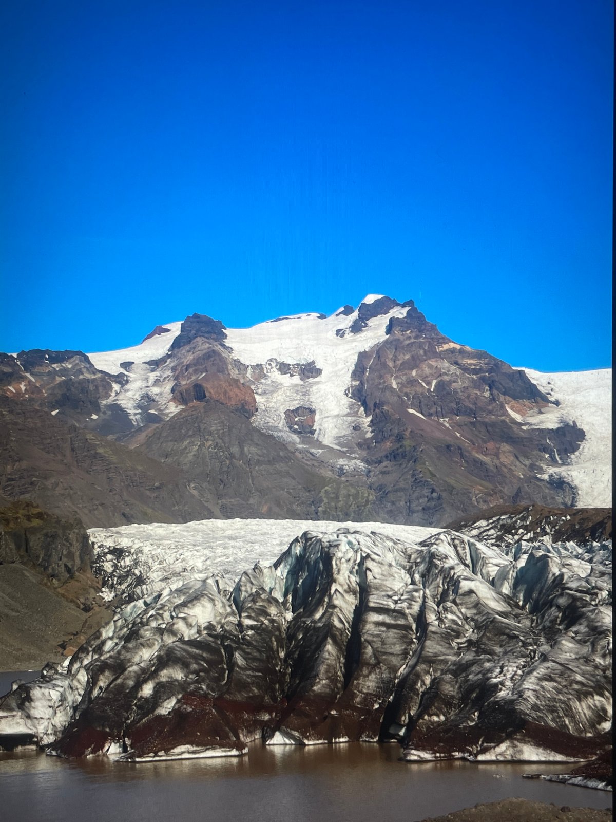 Tourist photographed at Iceland's Svínafellsjökull glacier during morning visit