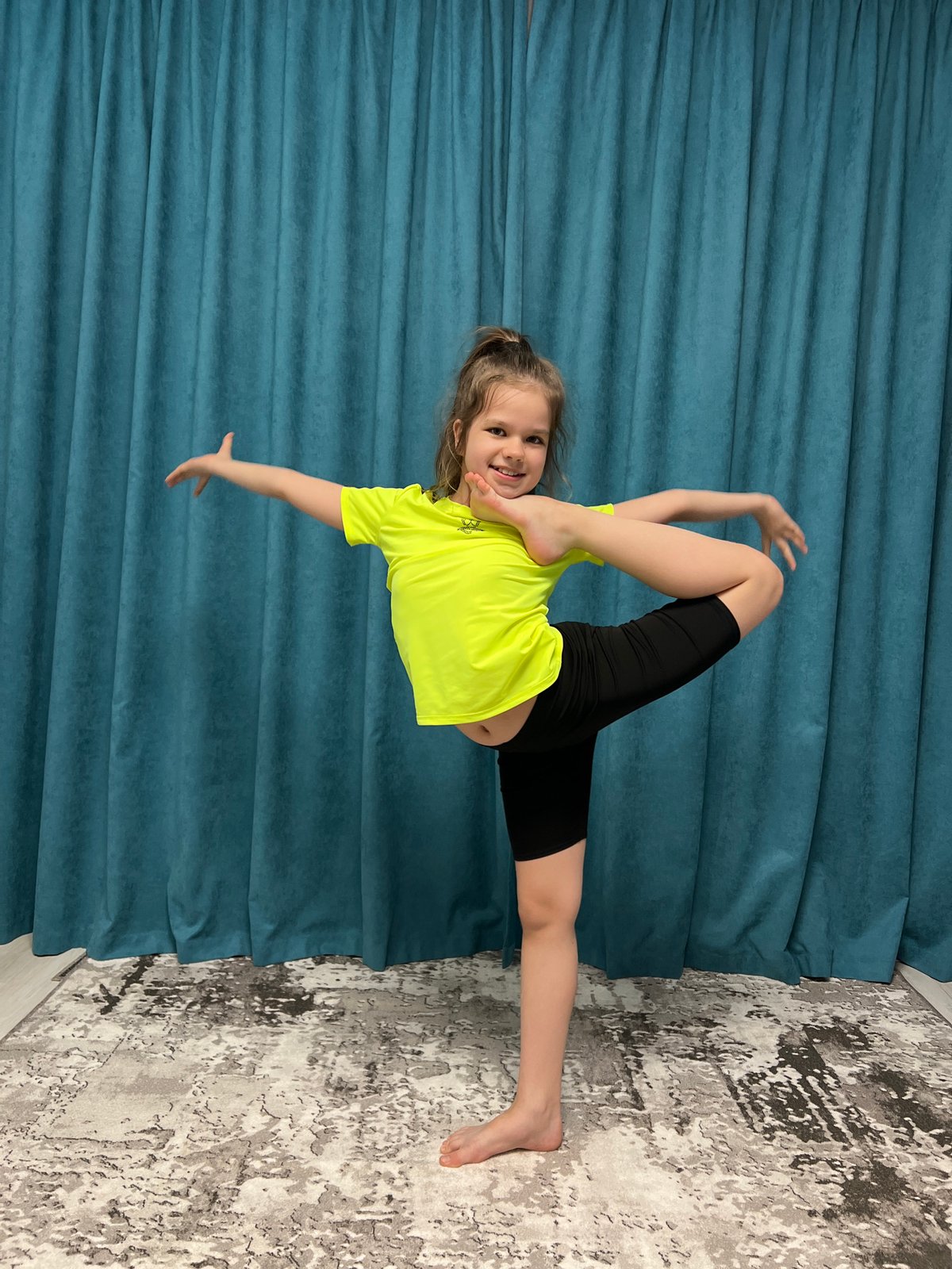 Girl practices gymnastics at home in Chaikovsky, Russia