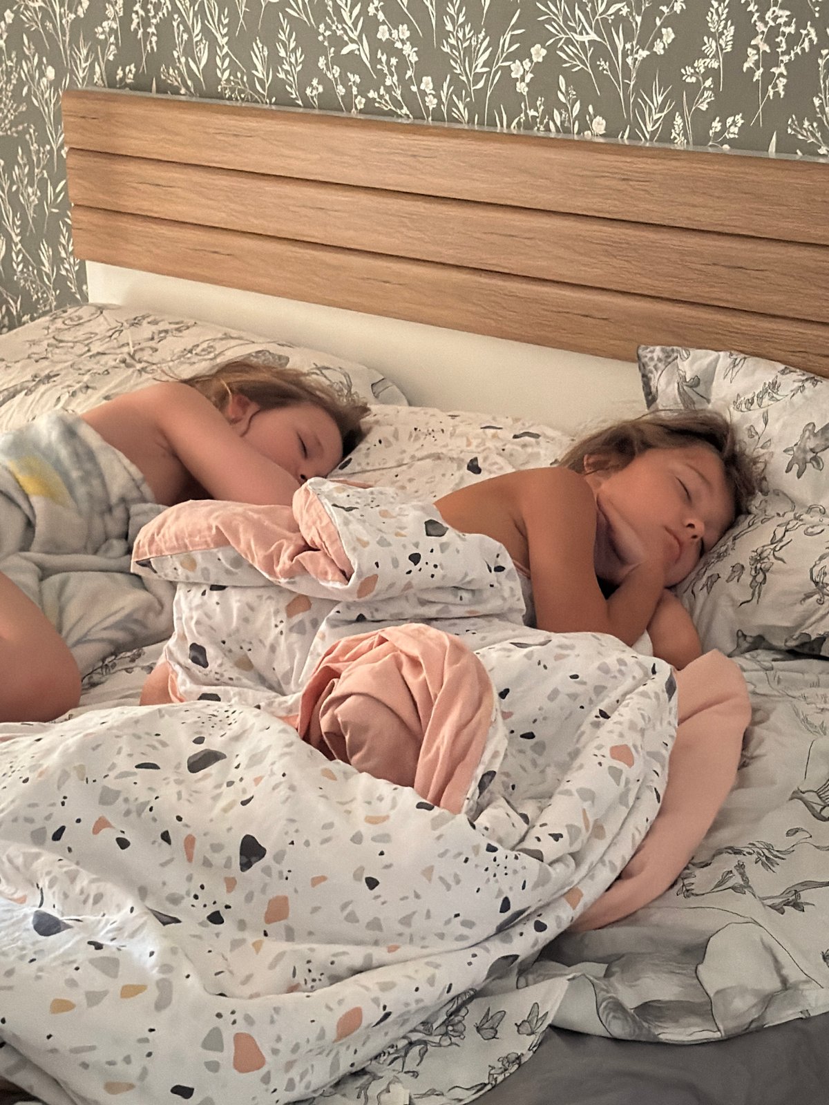 Two children sleep peacefully in Krasnoyarsk bedroom
