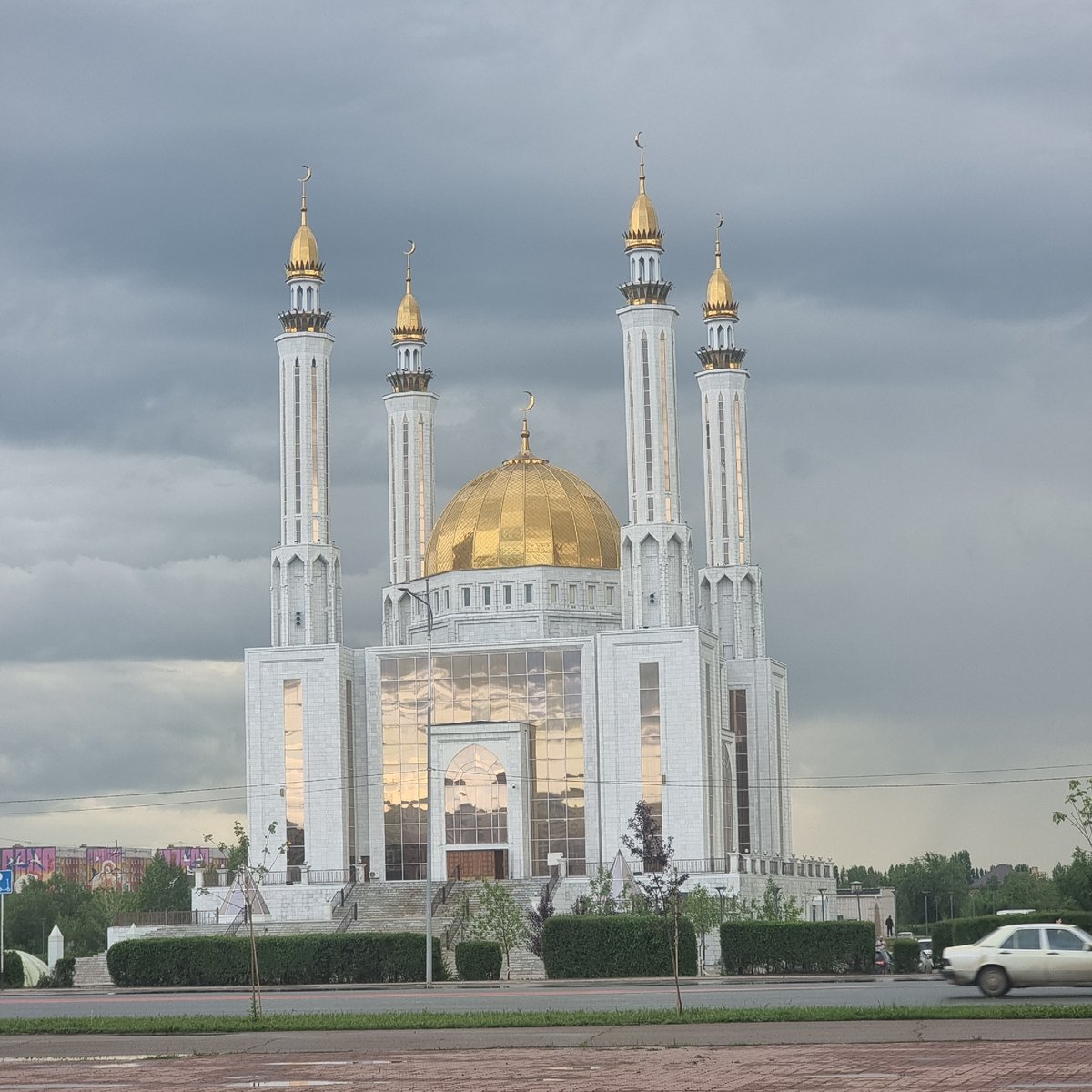 Afternoon stop at a mosque and spruce-lined grounds in Aktobe